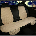 Beige quilted car seat covers on a black car interior